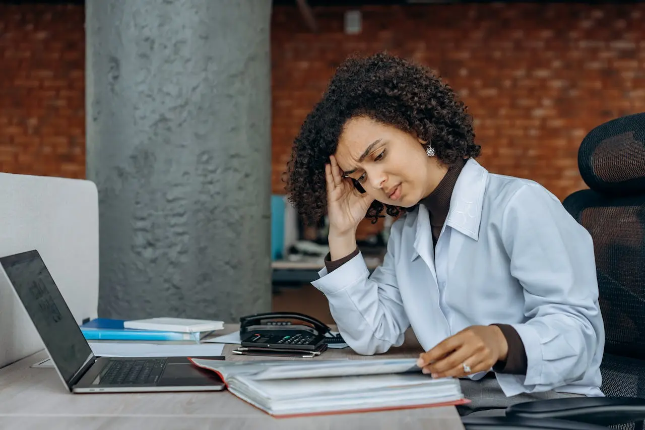 Frustrated woman reviewing documents