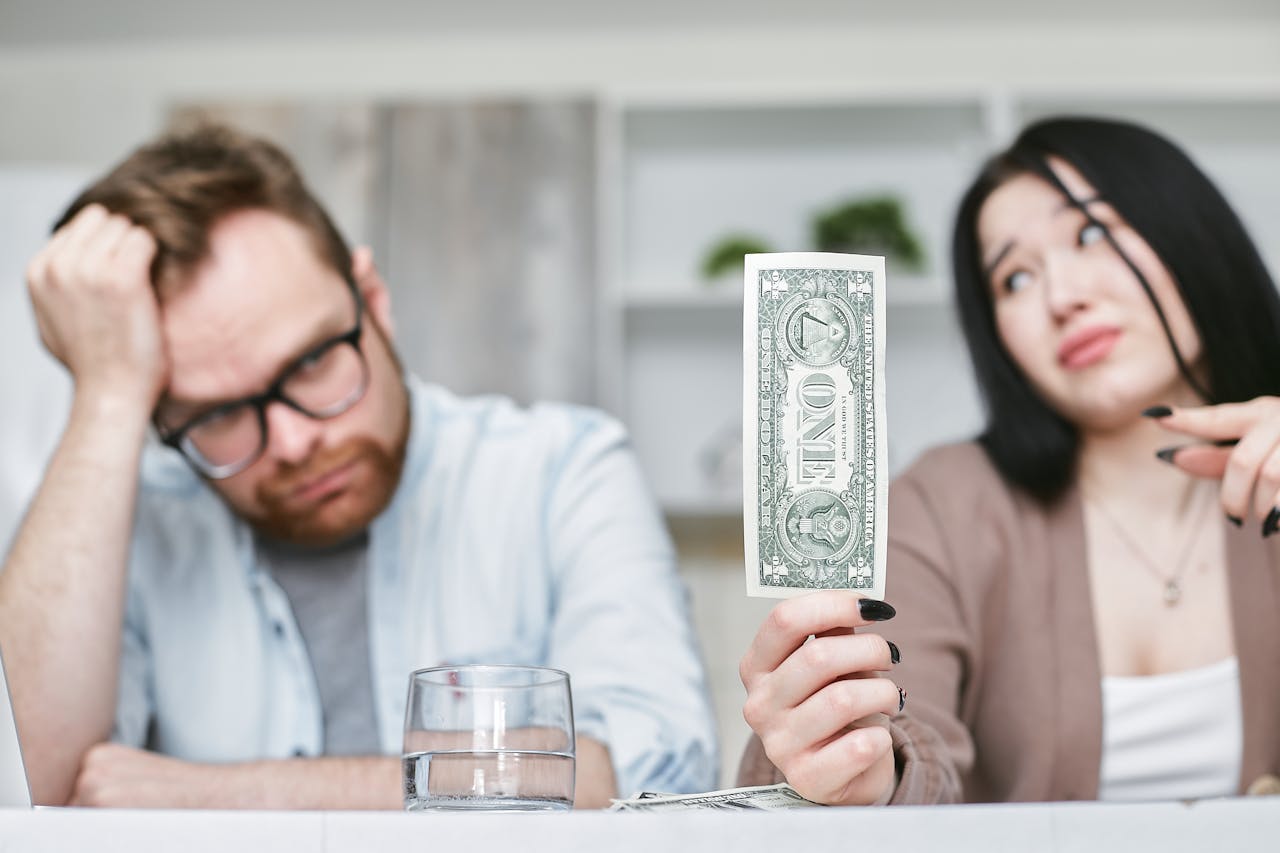 Woman pointing at a dollar bill