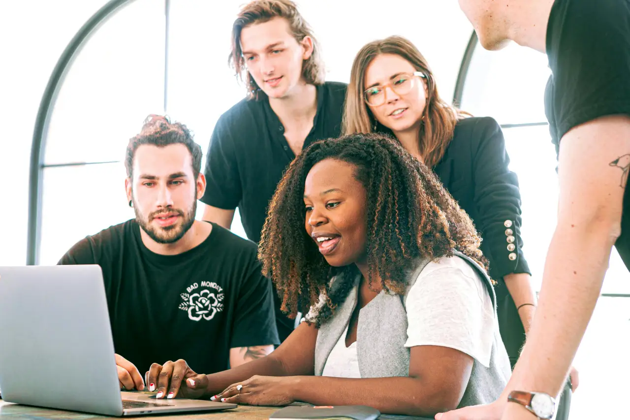 People looking at a new employee scheduling software