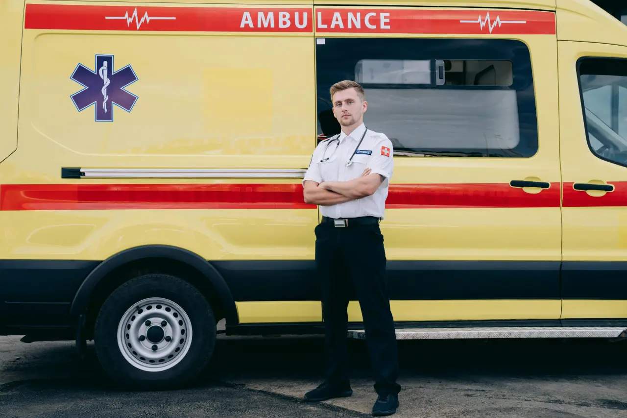 Emergency worker standing by an ambulance